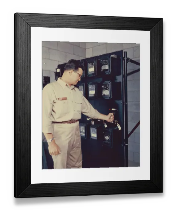 Framed Print : Worker Holding Light Switch Framed Print : Worker Holding Light Switch