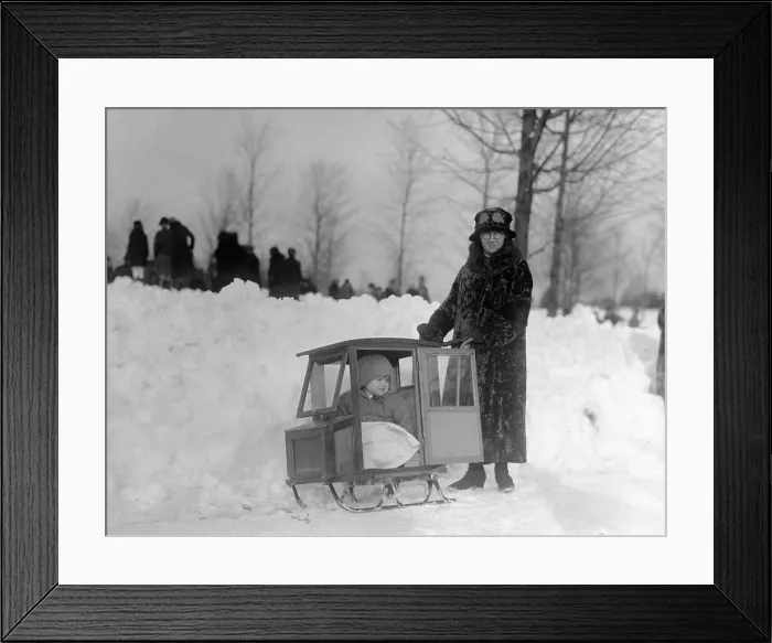 Framed Print : Child (12-23 months) in baby carriage sledge and mother in fur coat, Easton Street, Lawrence, Massachusetts, USA, February 08, 1926 Framed Print : Child (12-23 months) in baby carriage sledge and mother in fur coat, Easton Street, Lawrence, Massachusetts, USA, February 08, 1926