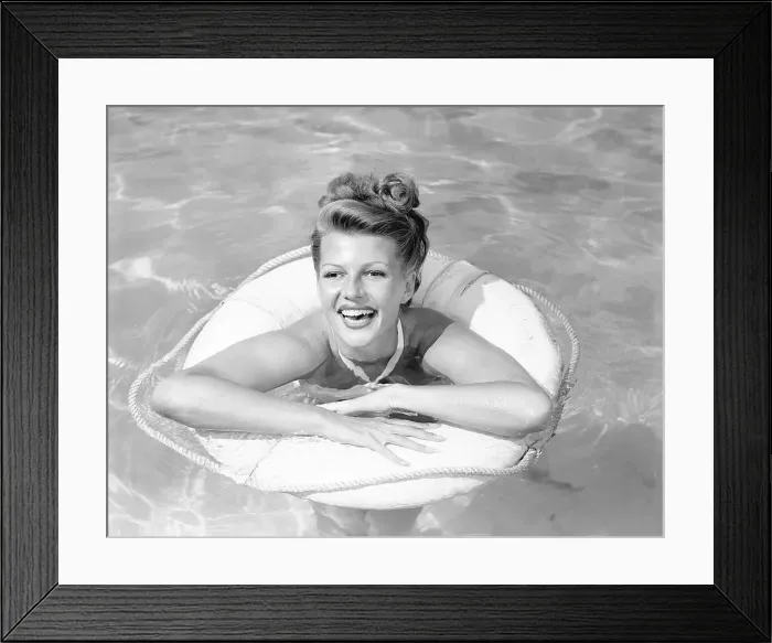 Framed Print : Rita Hayworth Posing in Swimming Pool Framed Print : Rita Hayworth Posing in Swimming Pool