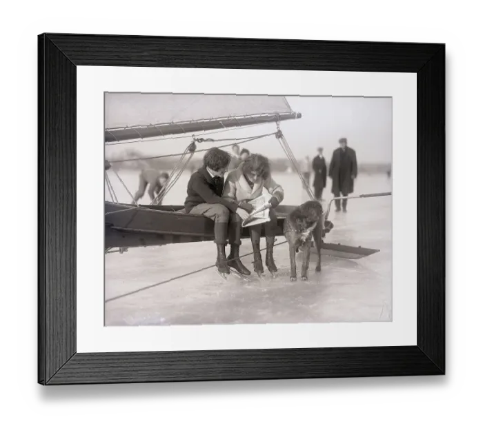 Framed Print : Ice Skaters Doing A Crossword Puzzle
