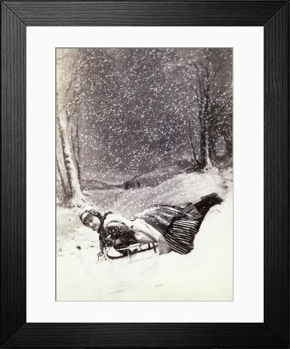 Framed Print : Young Woman Snow-Sledding Framed Print : Young Woman Snow-Sledding