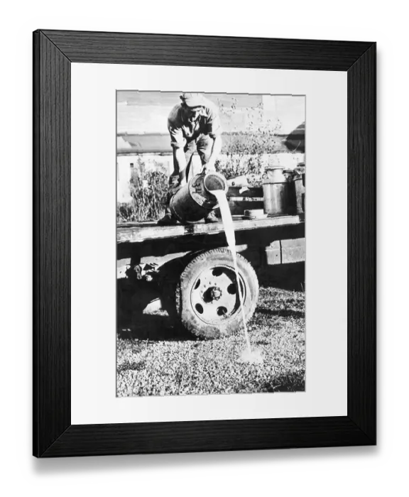 Framed Print : Milk Farmer Dumping Milk From Truck Framed Print : Milk Farmer Dumping Milk From Truck