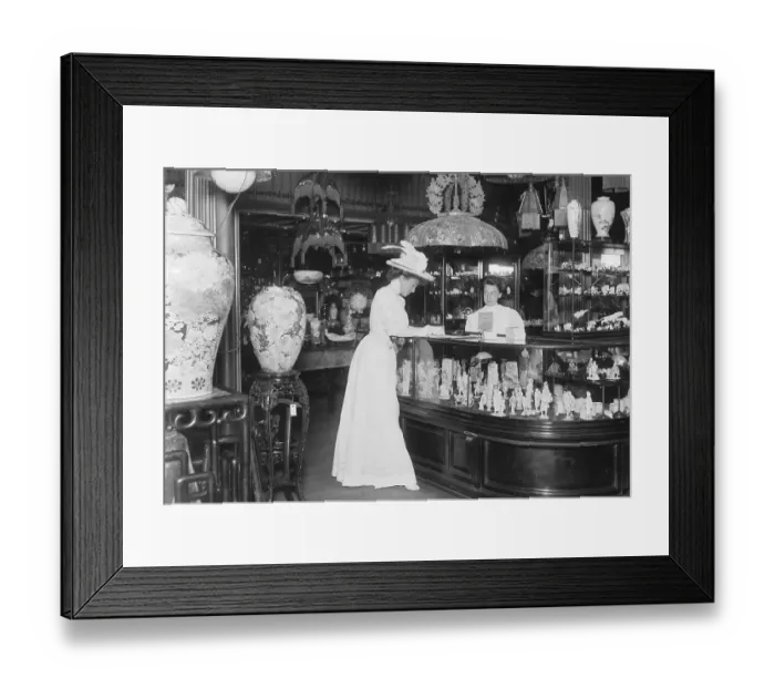 Framed Print : Woman Signing Card In Curio Shop Framed Print : Woman Signing Card In Curio Shop