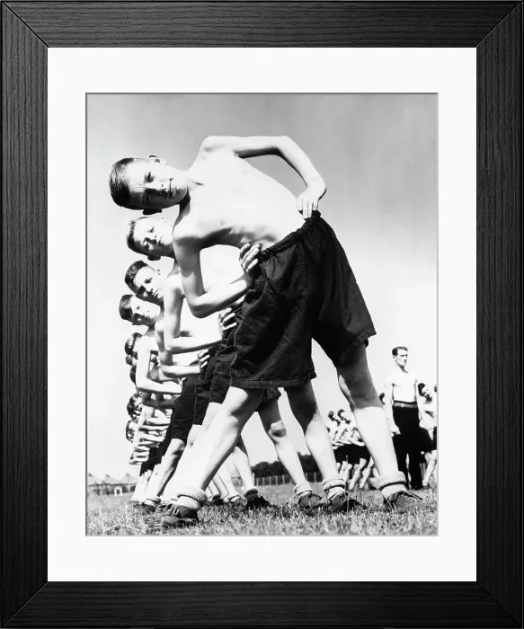 Framed Print : Teenage Boys Stretching on Field Framed Print : Teenage Boys Stretching on Field