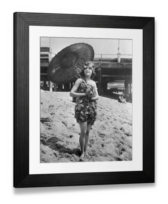 Framed Print : Young woman in stylish swimming costume posing on sandy beach Framed Print : Young woman in stylish swimming costume posing on sandy beach