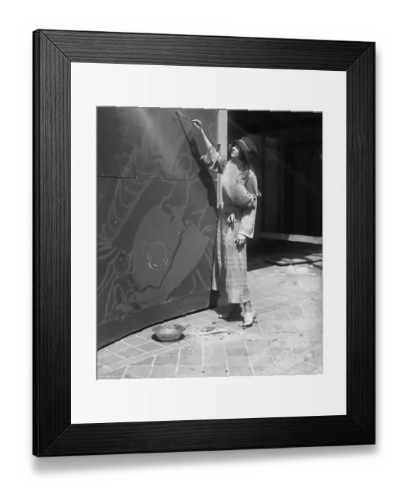 Framed Print : Young woman painting mural Framed Print : Young woman painting mural