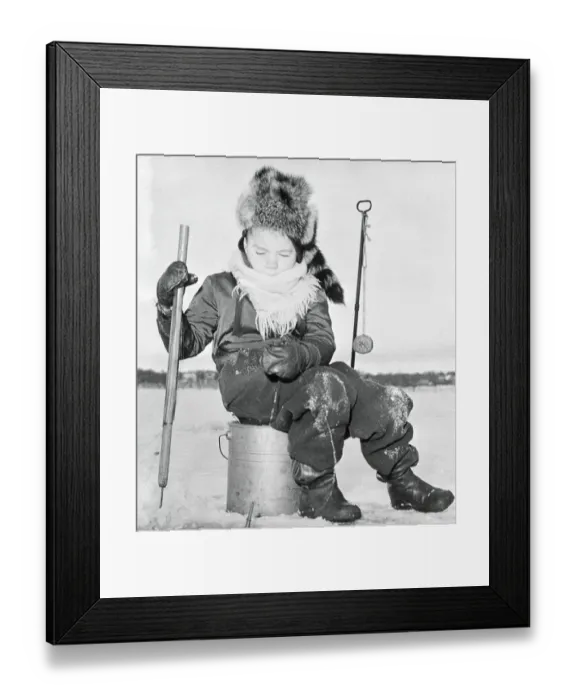 Framed Print : Young boy (6-7) ice fishing, Minneapolis, Minnesota, USA Framed Print : Young boy (6-7) ice fishing, Minneapolis, Minnesota, USA