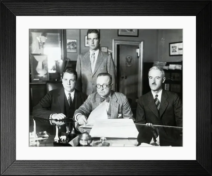 Framed Print : Men Sitting and Standing in Office Framed Print : Men Sitting and Standing in Office