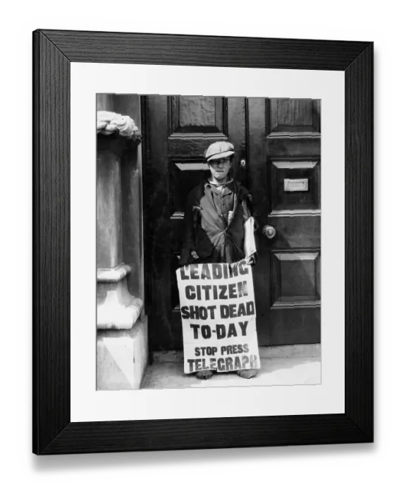 Framed Print : Newsboy Displaying Sign with Headline Framed Print : Newsboy Displaying Sign with Headline