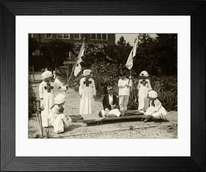 Framed Print : Children Staging Red Cross First Aid Drill During World War I Framed Print : Children Staging Red Cross First Aid Drill During World War I