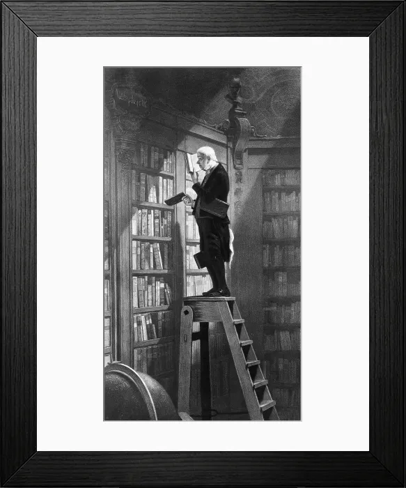 Framed Print : Man Reading on Ladder in Library Framed Print : Man Reading on Ladder in Library