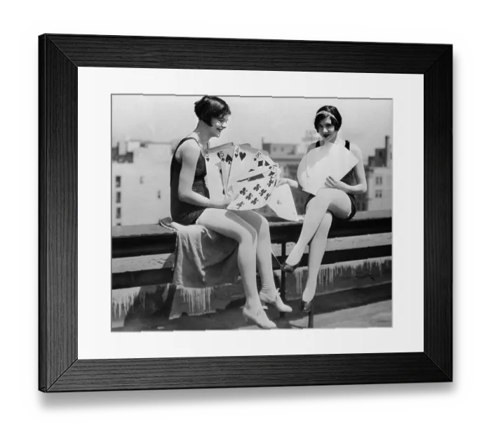 Framed Print : Yong smiling women playing big cards Framed Print : Yong smiling women playing big cards
