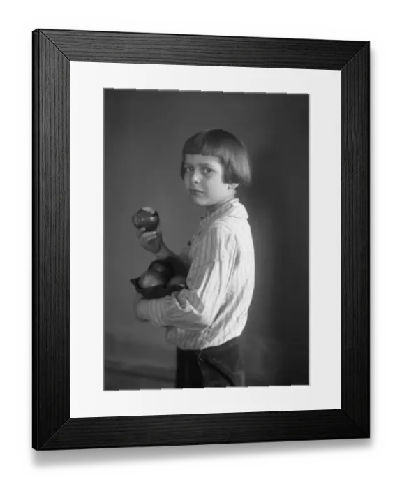 Framed Print : Portrait of girl (6-7) holding apples Framed Print : Portrait of girl (6-7) holding apples