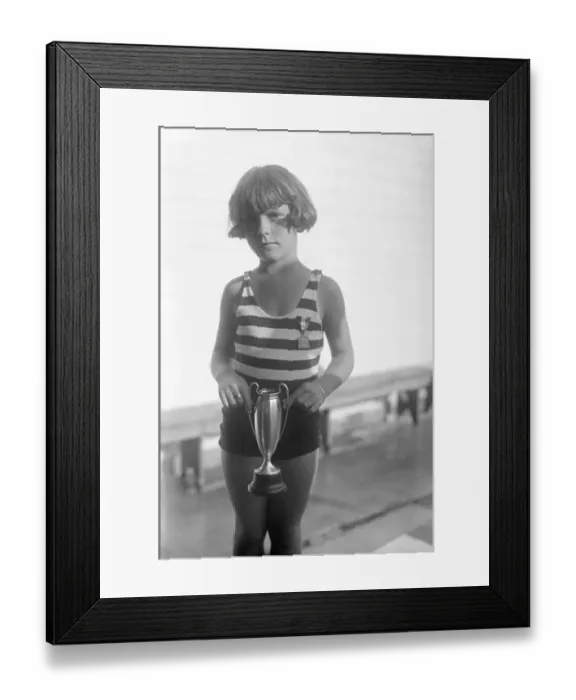 Framed Print : Portrait of girl (4-5) holding trophy Framed Print : Portrait of girl (4-5) holding trophy