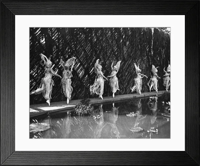 Framed Print : Women wearing costume dancing at pond Framed Print : Women wearing costume dancing at pond