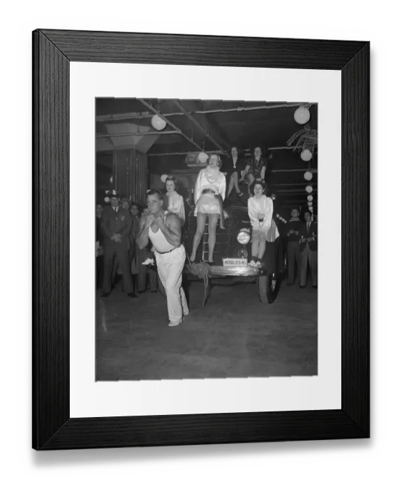 Framed Print : Man pulling car Framed Print : Man pulling car