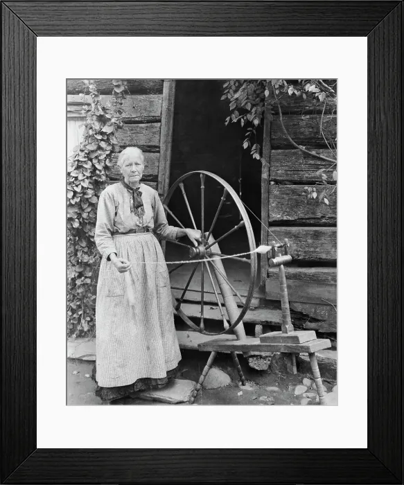 Framed Print : Old Woman At Spinning Wheel Outdoors