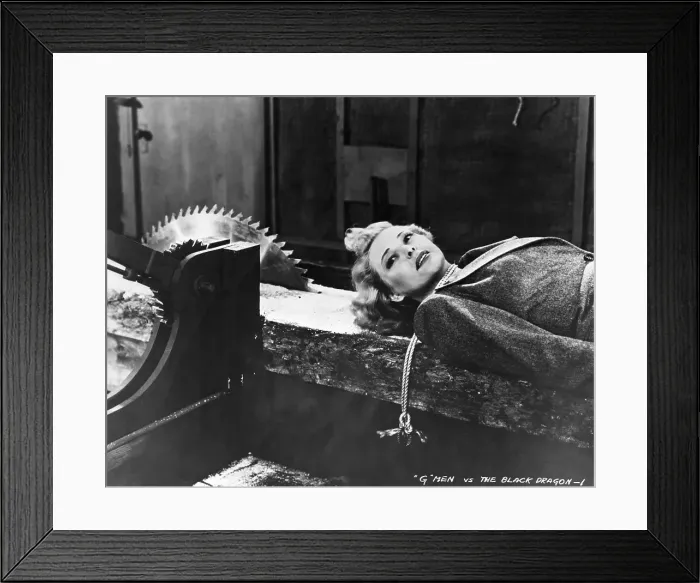 Framed Print : Woman Tied to Sawmill Conveyor Belt Framed Print : Woman Tied to Sawmill Conveyor Belt