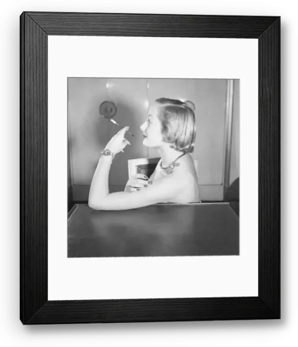 Framed Print : Woman Wearing Jewels and Smoking Framed Print : Woman Wearing Jewels and Smoking