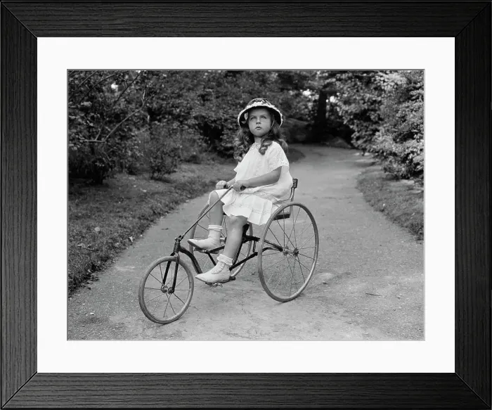 Framed Print : Little Girl Riding Tricycle Framed Print : Little Girl Riding Tricycle