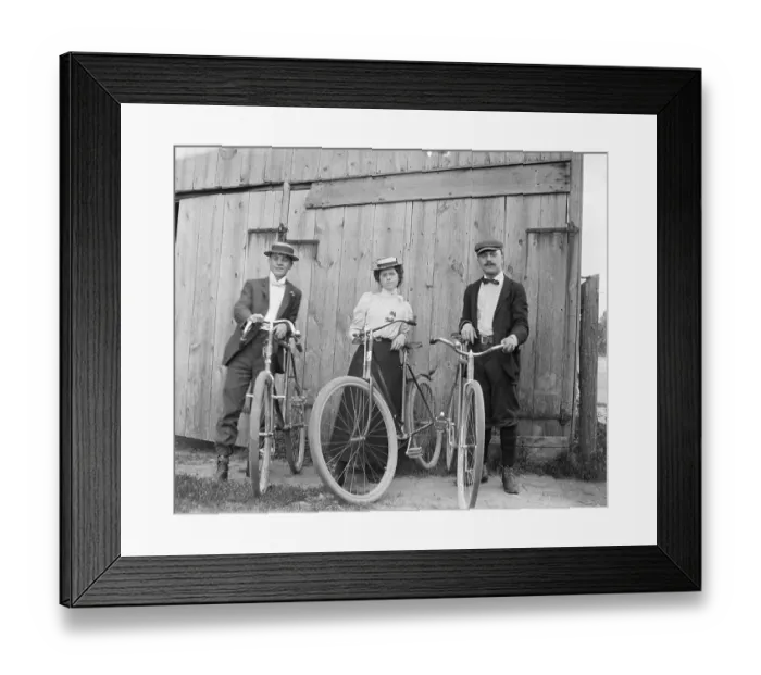 Framed Print : Woman Riding Bicycle With Two Men Framed Print : Woman Riding Bicycle With Two Men