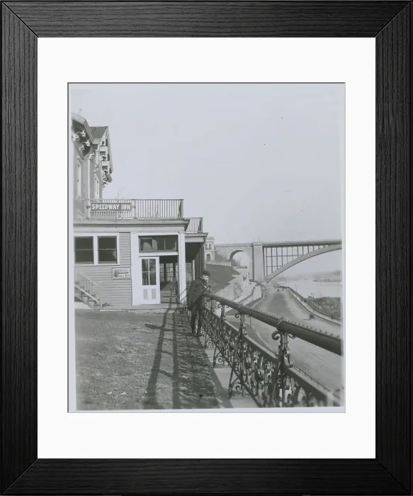 Framed Print : Man Peering Over Balcony of Speedway Inn Framed Print : Man Peering Over Balcony of Speedway Inn