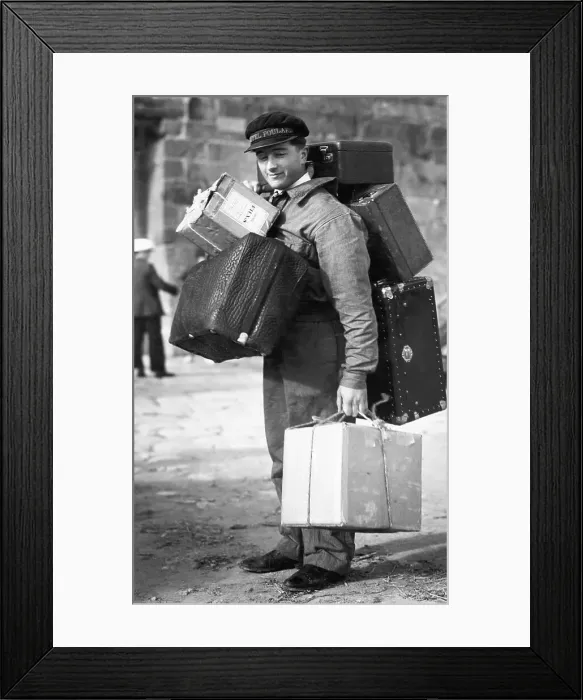 Framed Print : French Porter Carrying Heavy Luggage Framed Print : French Porter Carrying Heavy Luggage