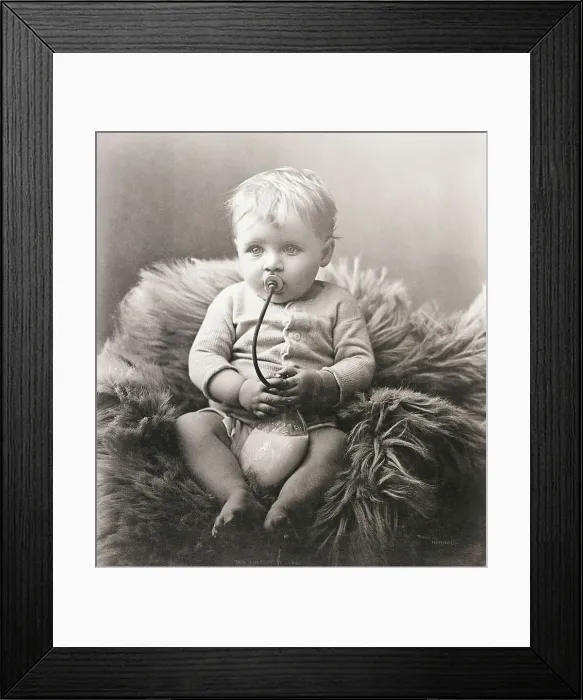 Framed Print : Baby Boy on Bear Rug Sucking on Milk Bottle Framed Print : Baby Boy on Bear Rug Sucking on Milk Bottle