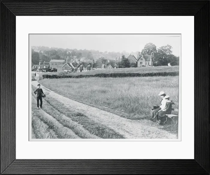 Framed Print : View of Field With Houses in Background Framed Print : View of Field With Houses in Background