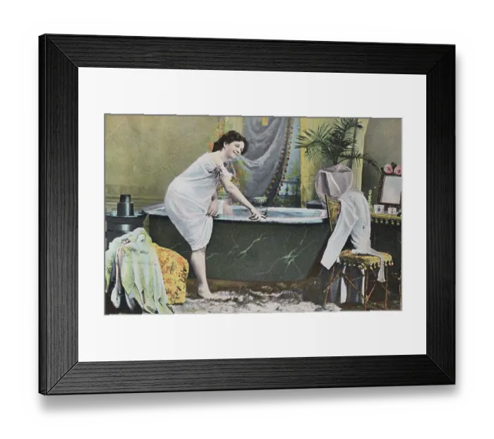 Framed Print : Woman Testing Water Temperature in Bathtub