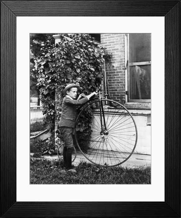 Framed Print : Boy Holding Old Large-Wheel Bicycle Framed Print : Boy Holding Old Large-Wheel Bicycle