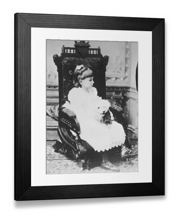 Framed Print : Helen Keller Holding Pet Poodle in Chair Framed Print : Helen Keller Holding Pet Poodle in Chair