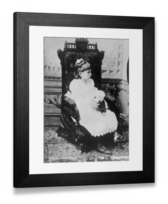 Framed Print : Helen Keller Holding Pet Poodle in Chair Framed Print : Helen Keller Holding Pet Poodle in Chair