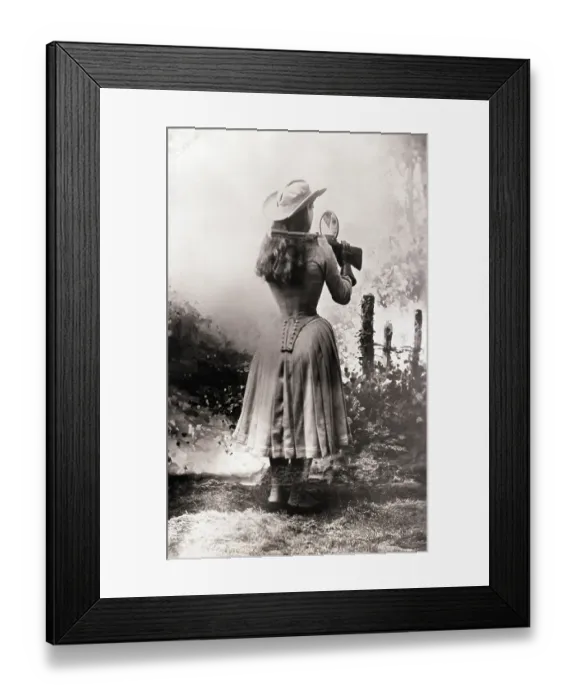 Framed Print : Annie Oakley Shooting Over Shoulder