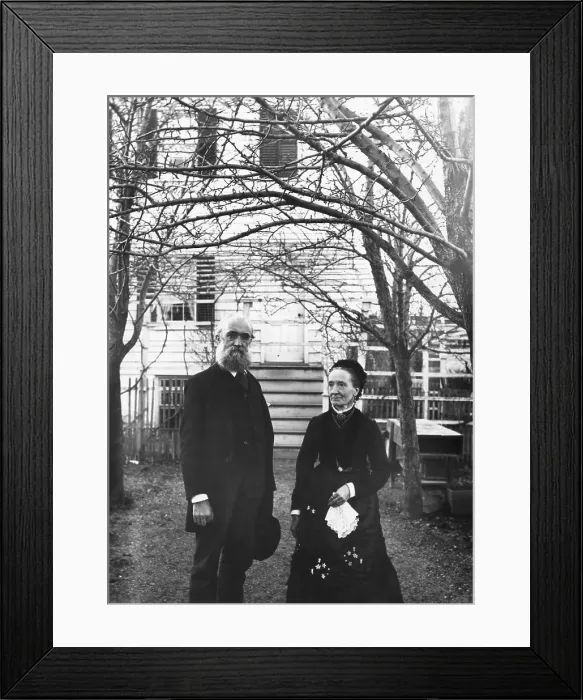 Framed Print : Elderly Couple Stand In Front Of Home Framed Print : Elderly Couple Stand In Front Of Home