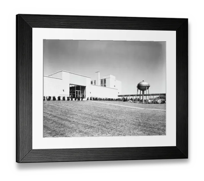 Framed Print : Water purification plant building, with water tower and well maintained grass lawn Framed Print : Water purification plant building, with water tower and well maintained grass lawn