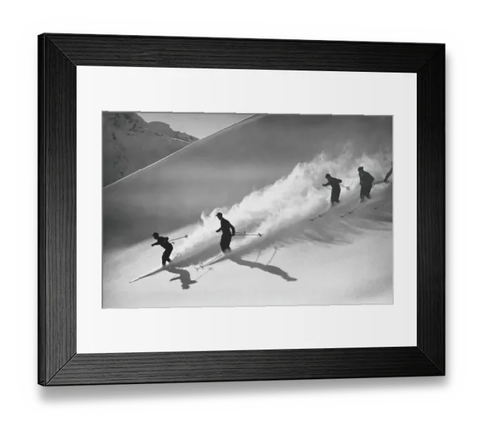 Framed Print : Group of skiers descending alpine slope, people in silhouette with sun low on horizon, casting long shadows on snow Framed Print : Group of skiers descending alpine slope, people in silhouette with sun low on horizon, casting long shadows on snow