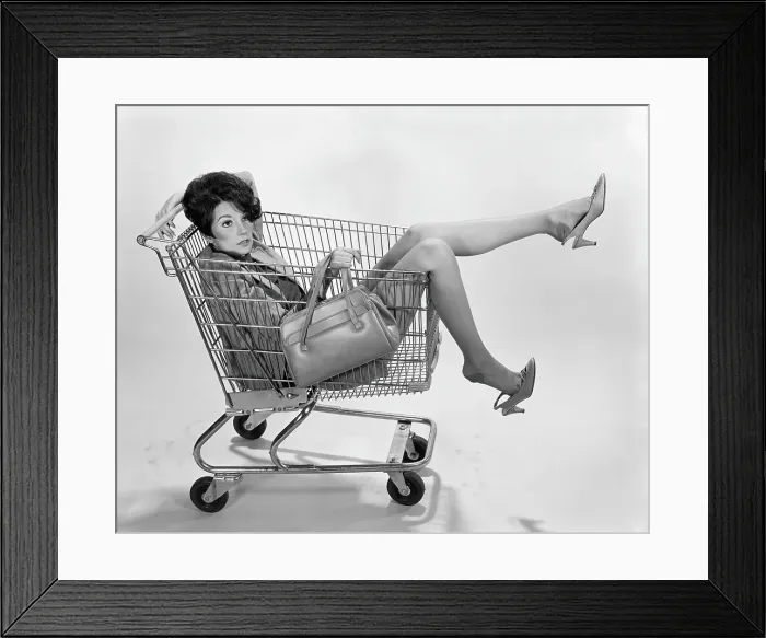 Framed Print : Woman sitting in shopping cart Framed Print : Woman sitting in shopping cart