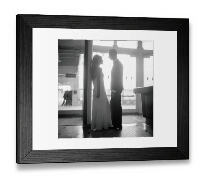 Framed Print : Silhouette of couple aboard ship, wearing formal dress, with sunlight shining through in background Framed Print : Silhouette of couple aboard ship, wearing formal dress, with sunlight shining through in background