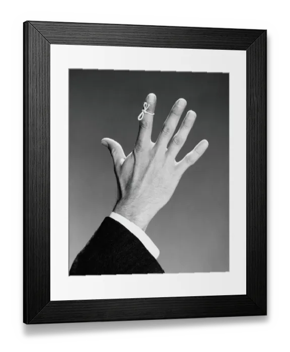 Framed Print : Man's hand with string tied around index finger Framed Print : Man's hand with string tied around index finger