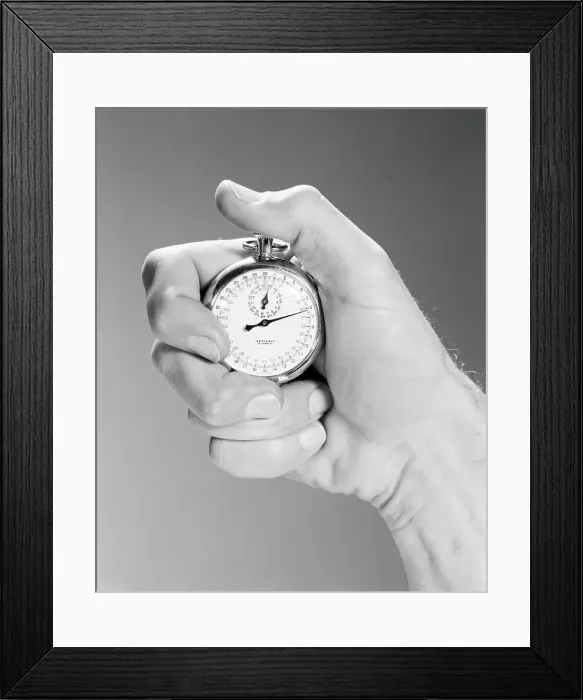 Framed Print : close up man's hand using stop watch indoor Framed Print : close up man's hand using stop watch indoor
