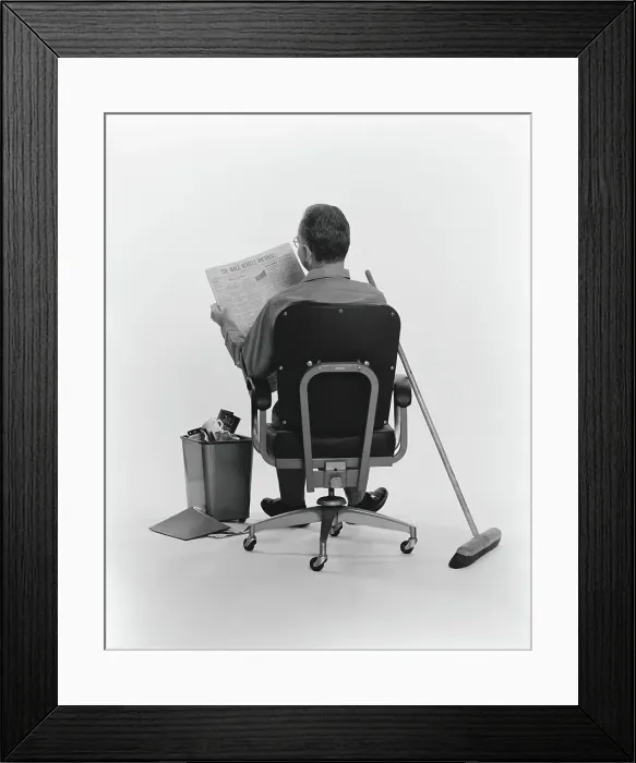 Framed Print : Janitor sitting, taking a break, reading the Wall Street Journal newspaper, rear view Framed Print : Janitor sitting, taking a break, reading the Wall Street Journal newspaper, rear view