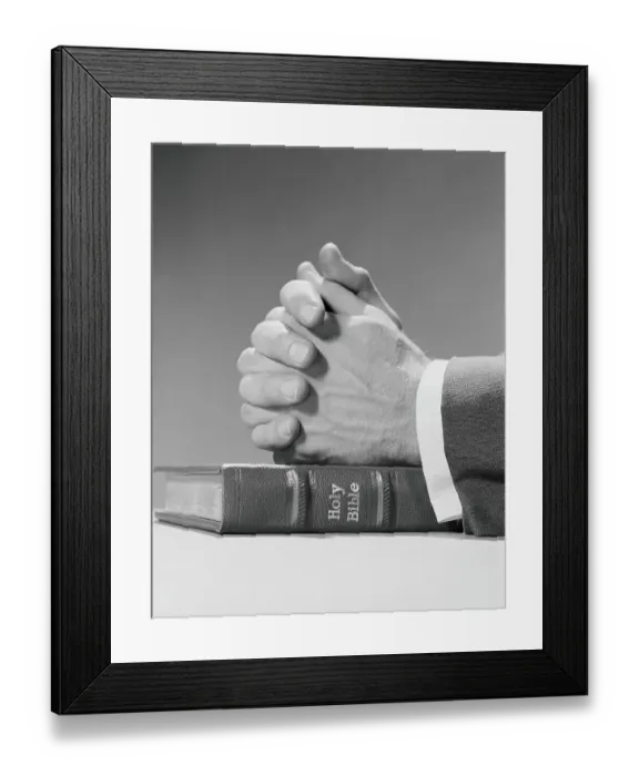 Framed Print : Man's hands resting on top of holy bible, in prayer