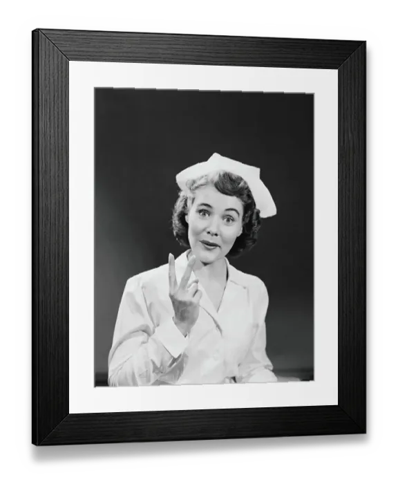 Framed Print : Nurse holding up two fingers signifying arrival of twin babies, portrait Framed Print : Nurse holding up two fingers signifying arrival of twin babies, portrait