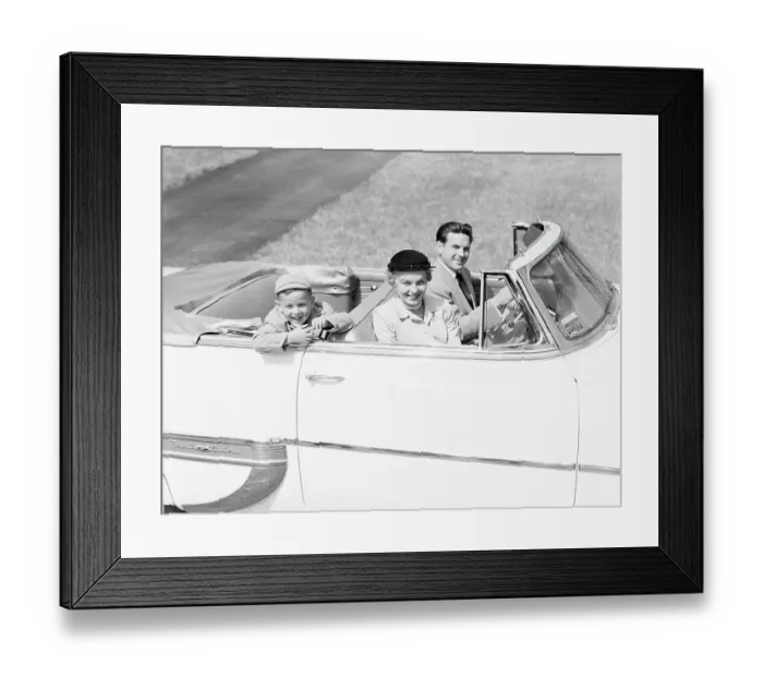 Framed Print : Family of three sitting in convertible car, smiling, portrait Framed Print : Family of three sitting in convertible car, smiling, portrait