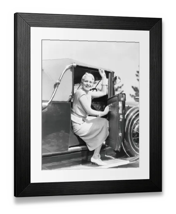 Framed Print : Woman in driver's seat of car, with door open, leaning out to wave Framed Print : Woman in driver's seat of car, with door open, leaning out to wave
