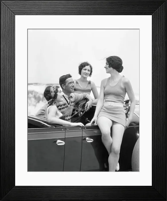 Framed Print : Man at steering wheel of convertible car, surrounded by three women dressed in bathing swim suits, sand dunes on horizon Framed Print : Man at steering wheel of convertible car, surrounded by three women dressed in bathing swim suits, sand dunes on horizon