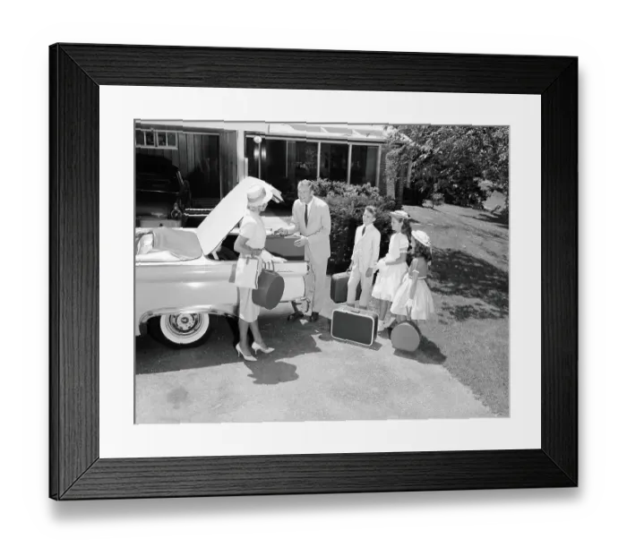 Framed Print : Family packing suitcases in trunk of car parked on driveway, preparing for vacation Framed Print : Family packing suitcases in trunk of car parked on driveway, preparing for vacation