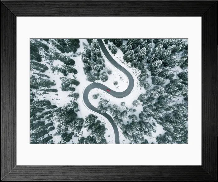 Framed Print : Aerial view of winding road in winter forest Framed Print : Aerial view of winding road in winter forest