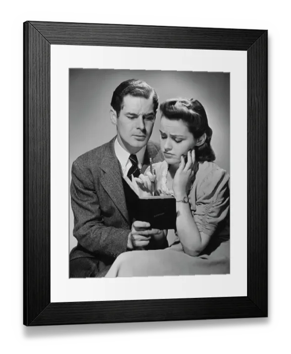 Framed Print : A Bad Day. A young couple writing a sad entry in a journal, circa 1940 Framed Print : A Bad Day. A young couple writing a sad entry in a journal, circa 1940